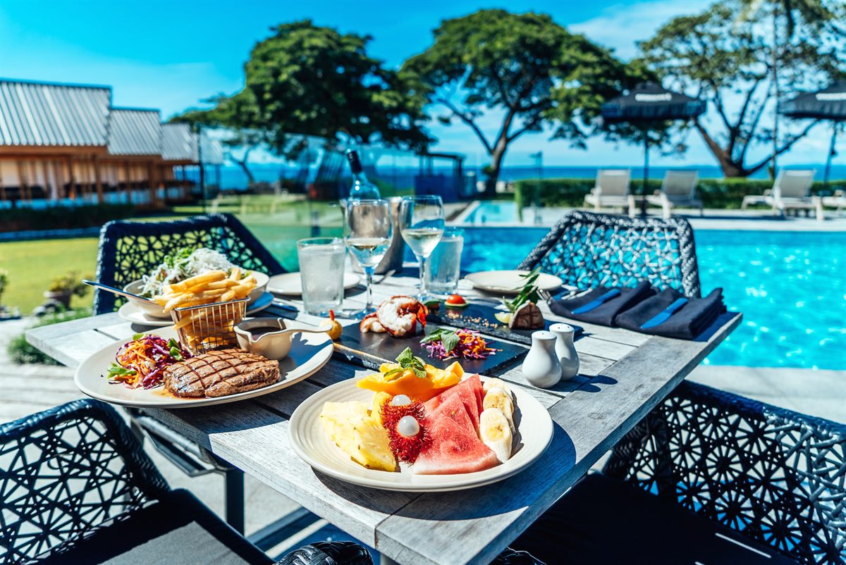 Breakfast by the pool at Coral Sea Resort
